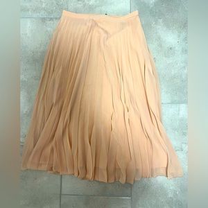 Below knee, plise skirt in blush pink from Asos